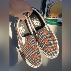 Vans Black and White Slip-Ons with Orange Tiger Print